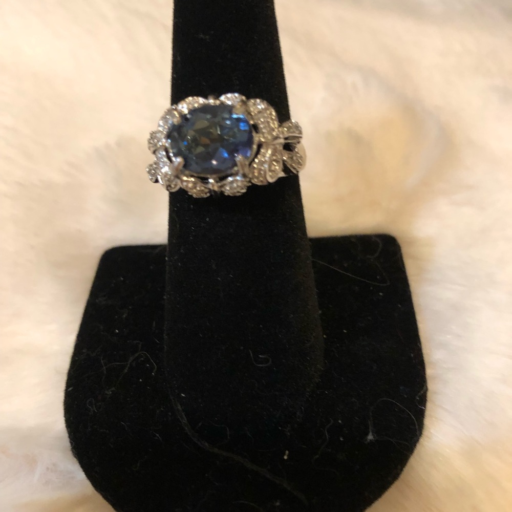 Stunning sterling silver (90+%) with oval blue stone surrounded by diamonds